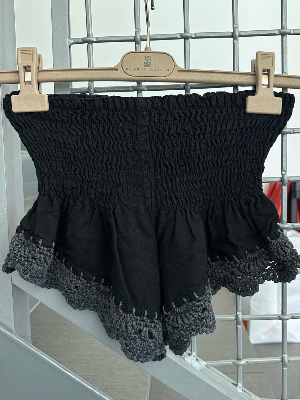 Black crochet mini shorts with elastic waistband and ruffle hem One Size